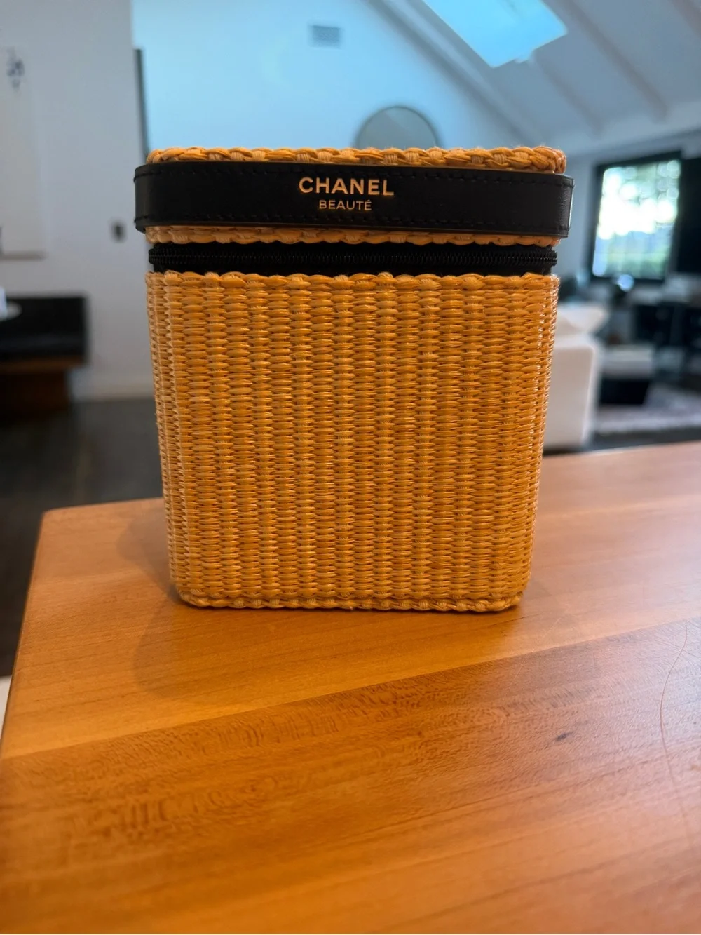 CHANEL Straw Cosmetic Case in Natural and Black with products